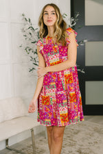 Load image into Gallery viewer, Lizzy Flutter Sleeve Dress in Patchwork Floral
